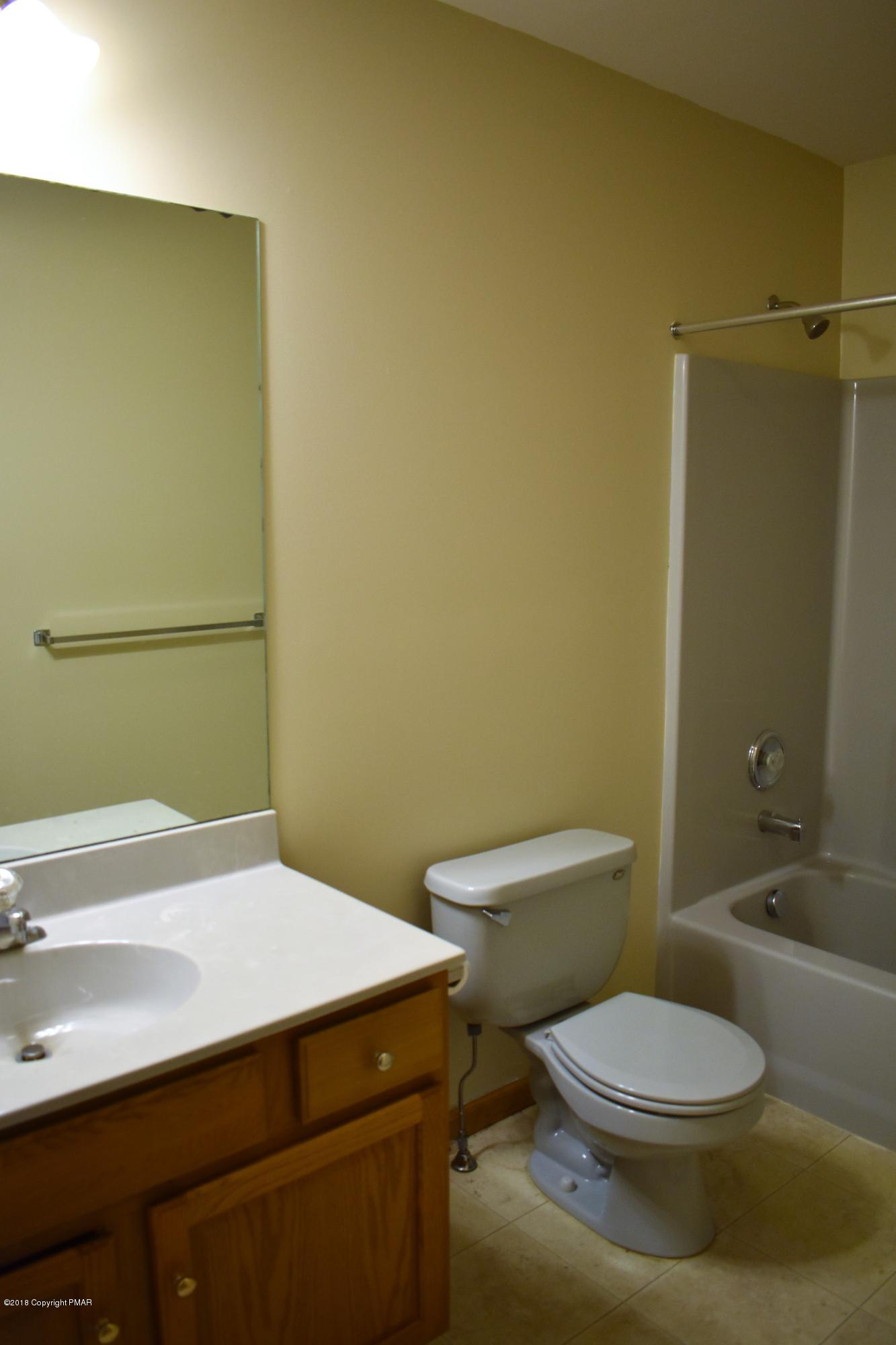 33 Sassafras Road Albrightsville, PA 18210 - Photo 29 of 36 a white toilet sitting next to a bathroom sink