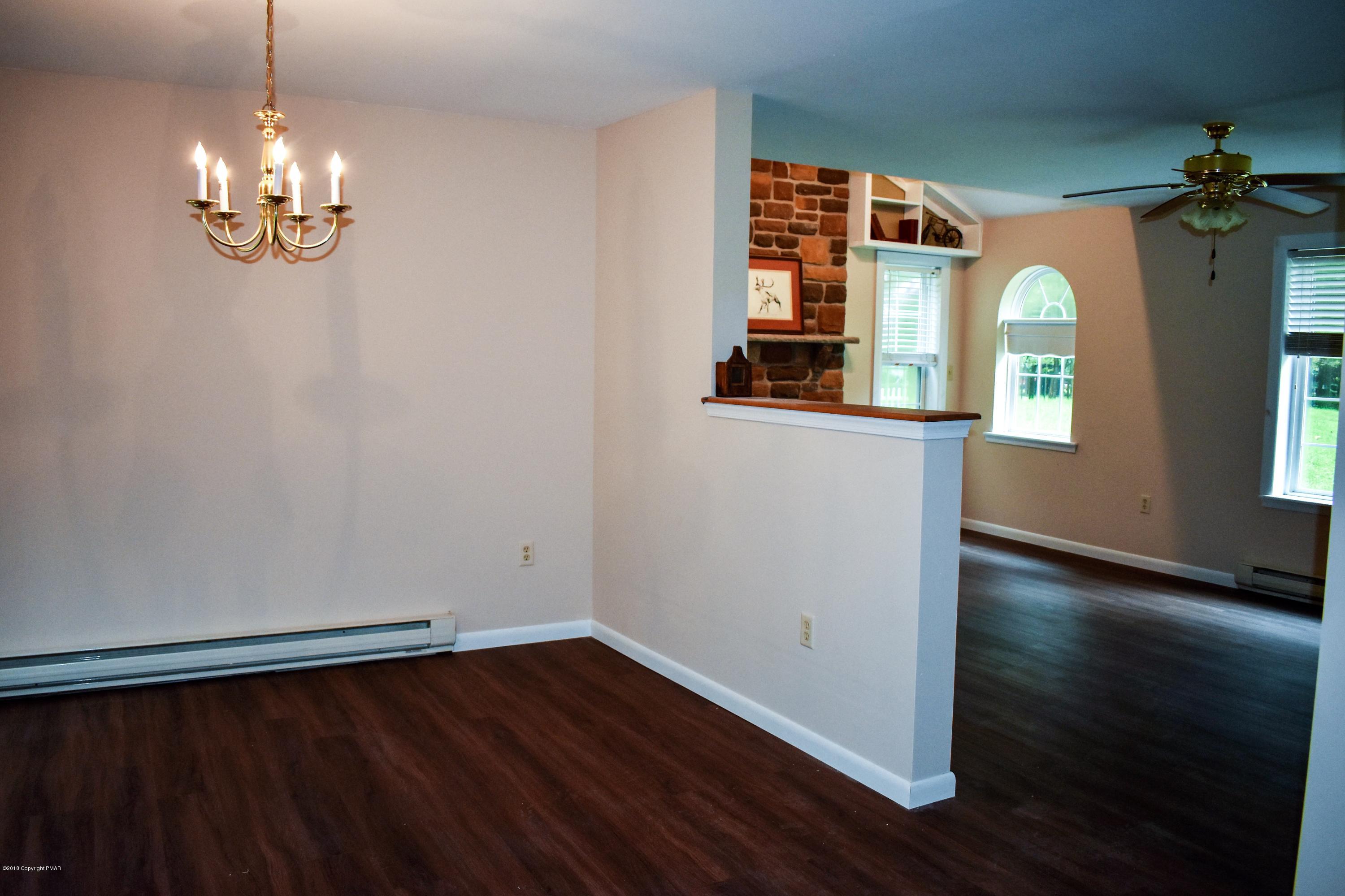 33 Sassafras Road Albrightsville, PA 18210 - Photo 8 of 36 wooden floor in an empty room with a window
