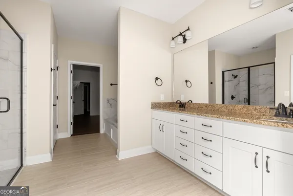 a bathroom with a glass shower door