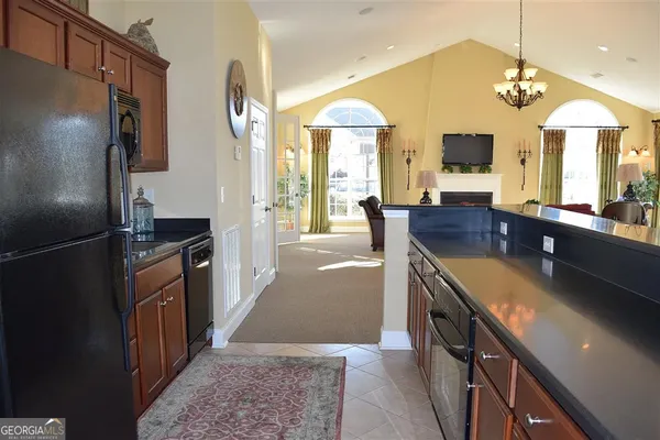a room with pool table and windows