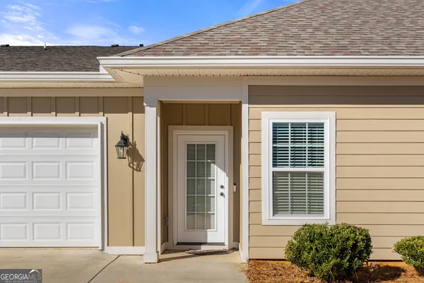 a front view of a house with a garage