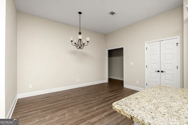 a view of a livingroom with wooden floor