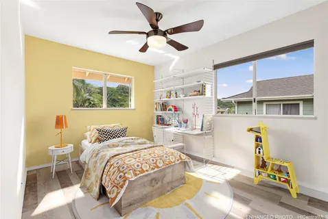 a bedroom with a bed and a table in it