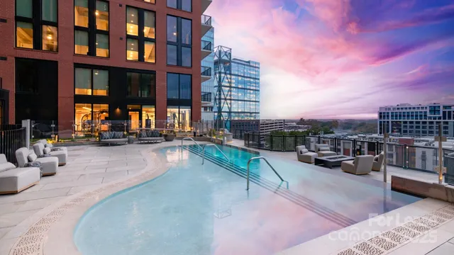 a view of a swimming pool with a lounge chair