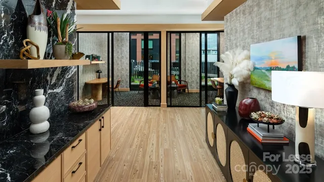 a dining room with furniture and wooden floor