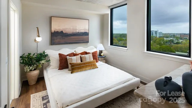 a bedroom with furniture and window