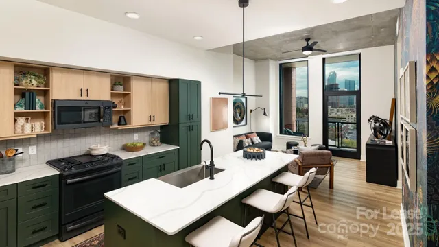 a kitchen with a table chairs stove and refrigerator