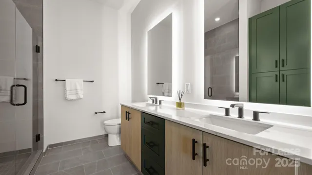 a bathroom with a granite countertop sink a toilet and mirror