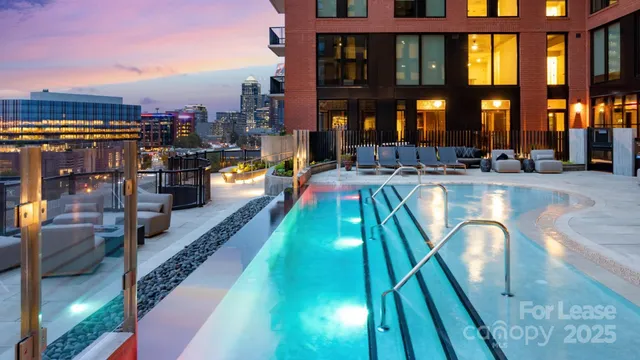 a swimming pool view with a outdoor seating
