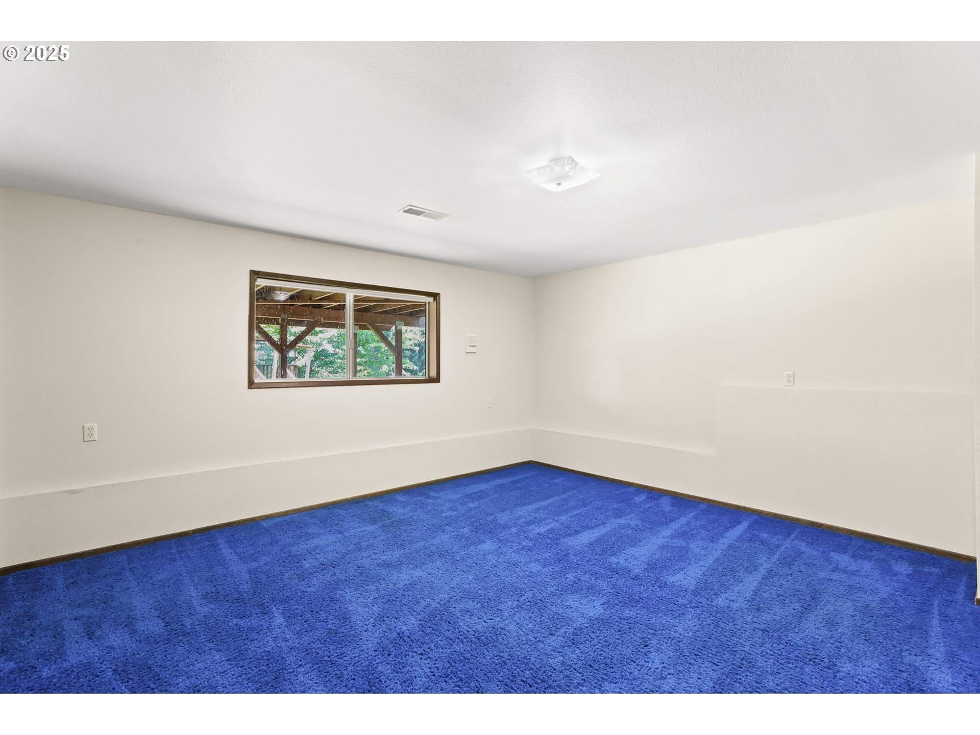 17501 Southeast Fosberg Road Boring, OR 97009 - Photo 21 of 48 a view of an empty room with wooden floor and a window