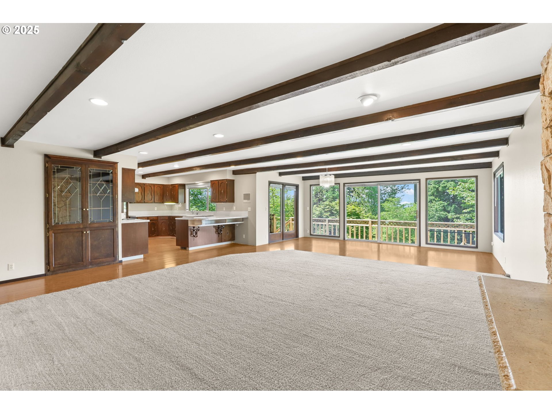 17501 Southeast Fosberg Road Boring, OR 97009 - Photo 5 of 48 a view of an empty room with wooden floor and a window