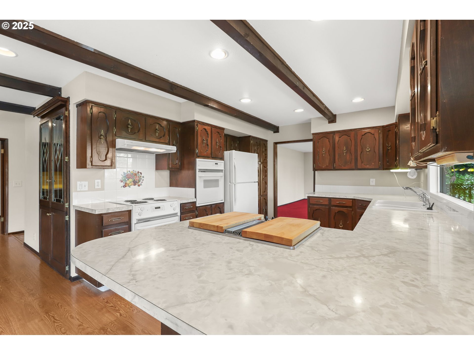 17501 Southeast Fosberg Road Boring, OR 97009 - Photo 6 of 48 a kitchen with stainless steel appliances kitchen island granite countertop a sink and cabinets