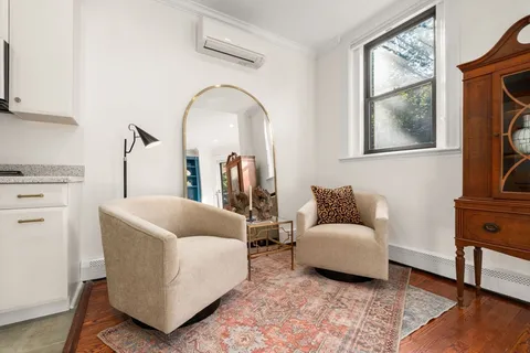 a living room with furniture and a window