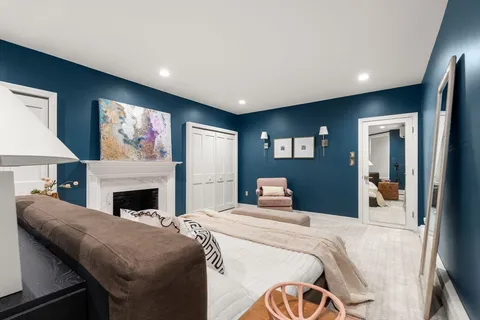 a bed room with a bed and a television