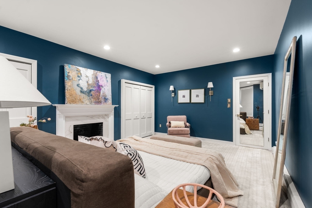 457 Beacon Street, Unit 5 Boston, MA 02115 - Photo 15 of 22 a bed room with a bed and a television