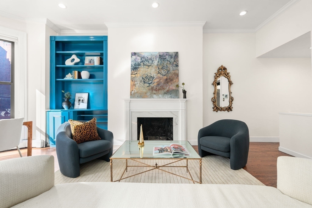 457 Beacon Street, Unit 5 Boston, MA 02115 - Photo 2 of 22 a living room with furniture a couch and a fireplace