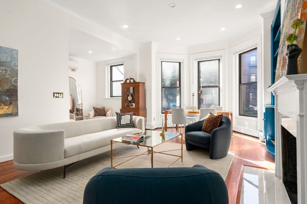 457 Beacon Street, Unit 5 Boston, MA 02115 - Photo 3 of 22 a living room with furniture and a fireplace