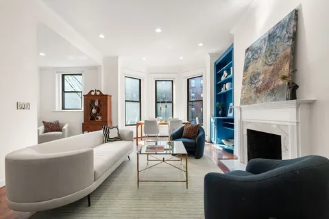 a living room with furniture or fireplace and a large mirror