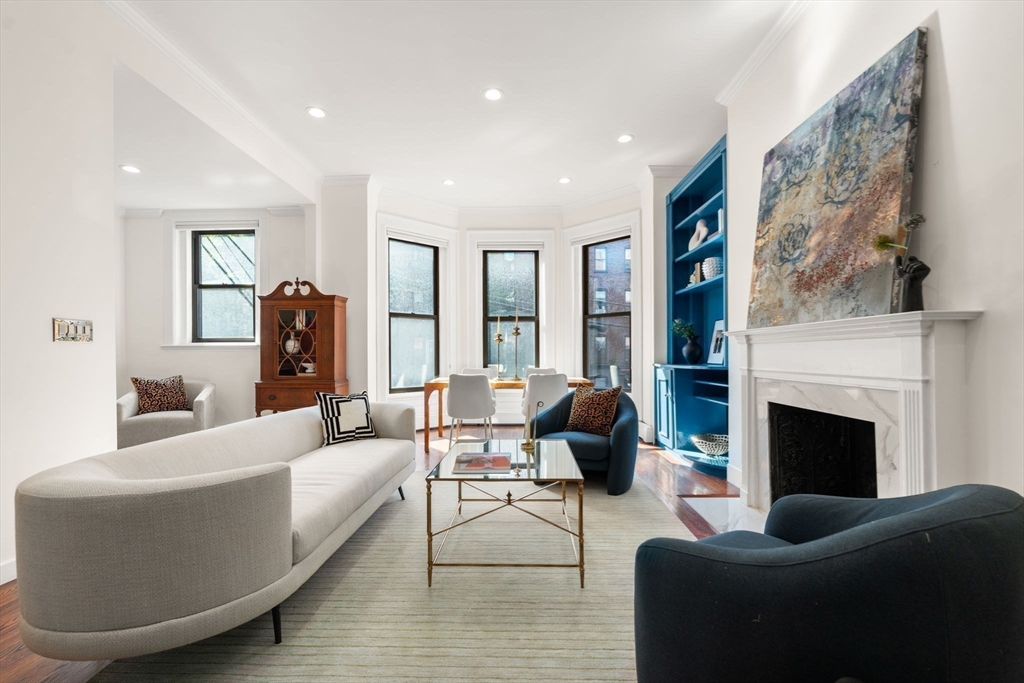 457 Beacon Street, Unit 5 Boston, MA 02115 - Photo 4 of 22 a living room with furniture or fireplace and a large mirror