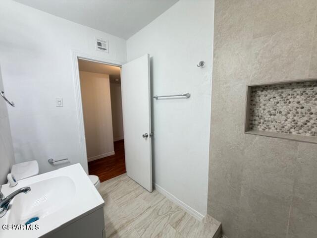 305 Edith Drive El Paso, TX 79915 - Photo 18 of 25 a bathroom with a sink and a mirror