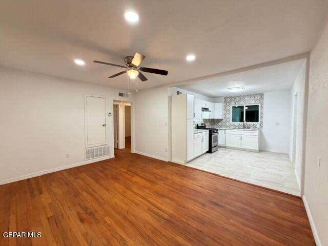 305 Edith Drive El Paso, TX 79915 - Photo 6 of 25 a view of a kitchen with a sink and a refrigerator