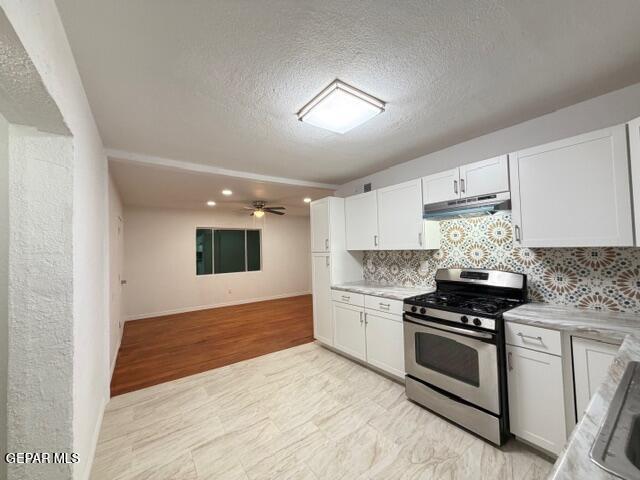 305 Edith Drive El Paso, TX 79915 - Photo 8 of 25 a kitchen with granite countertop a stove and a sink