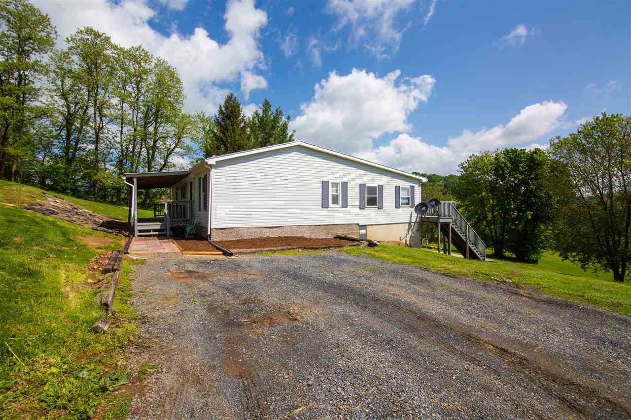 9478 Waggys Creek Road Dayton, VA 22821 - Photo 18 of 36 a view of house with backyard and trees around