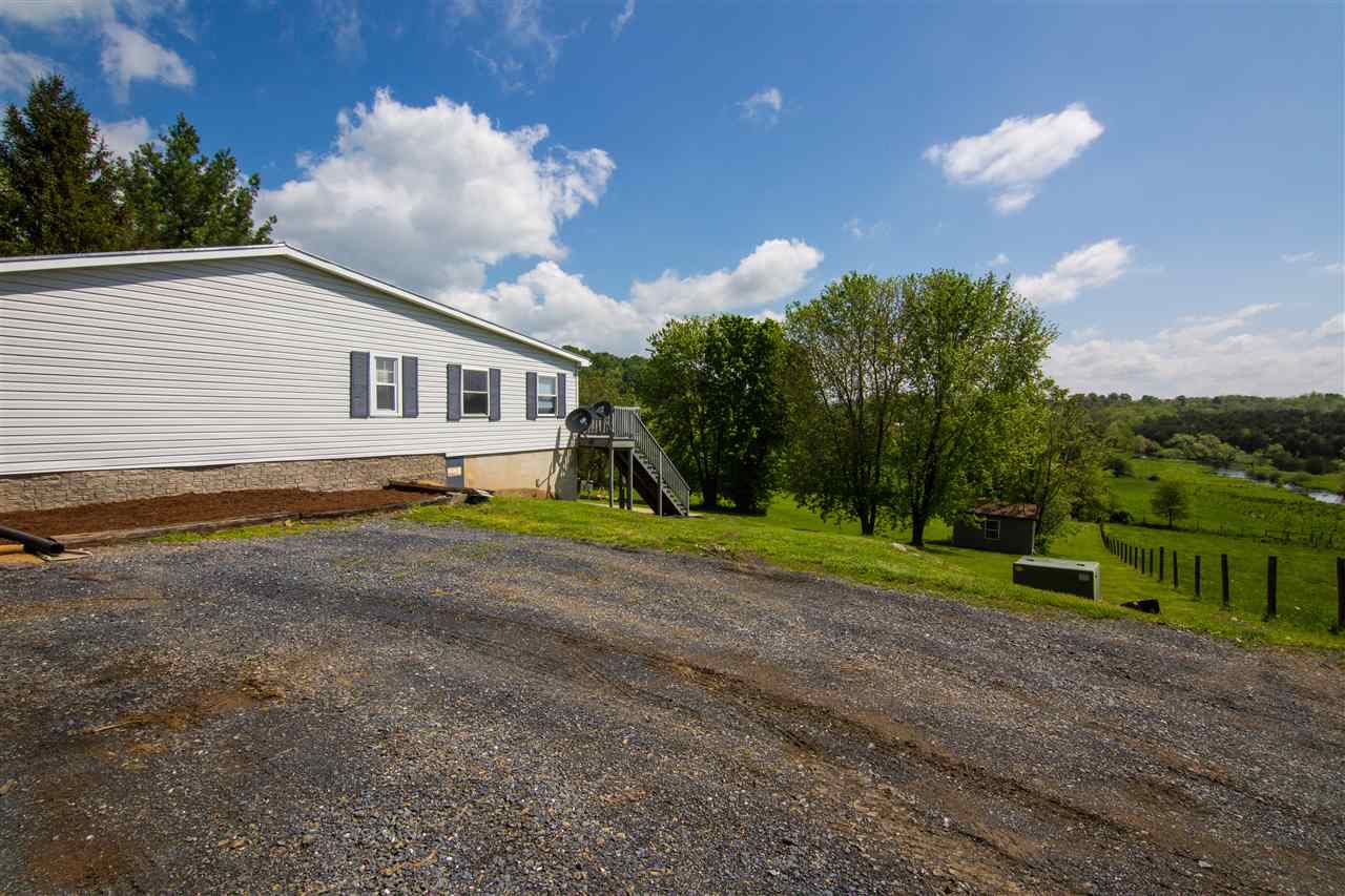 9478 Waggys Creek Road Dayton, VA 22821 - Photo 19 of 36 a view of a house with a backyard and a yard