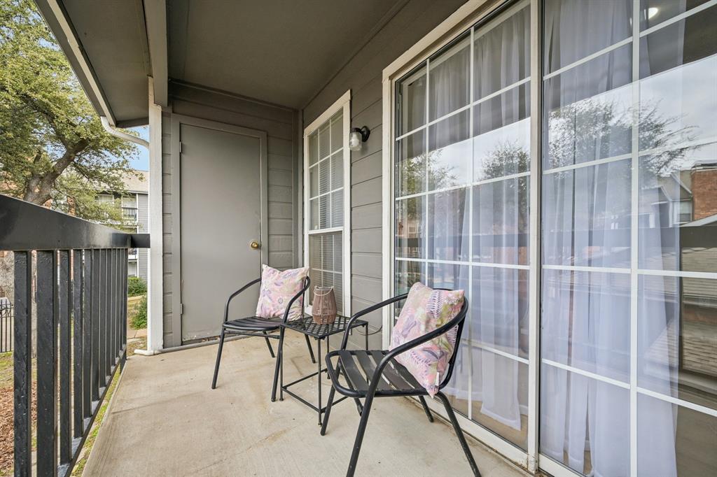 18333 Roehampton Drive, Unit 128 Dallas, TX 75252 - Photo 27 of 40 a view of chair and table in the balcony