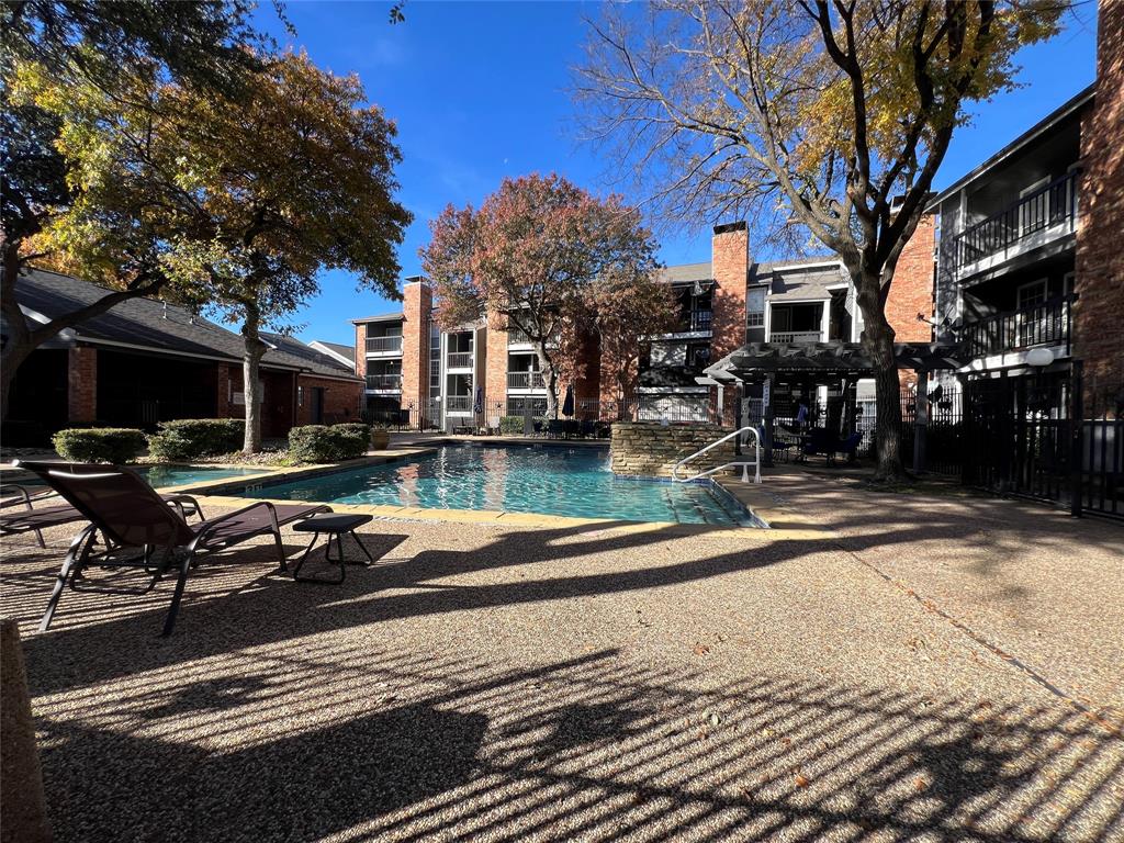 18333 Roehampton Drive, Unit 128 Dallas, TX 75252 - Photo 30 of 40 a view of a house with backyard and sitting area