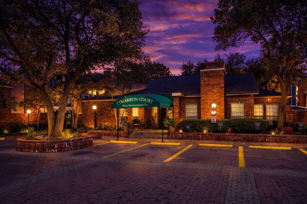 18333 Roehampton Drive, Unit 128 Dallas, TX 75252 - Photo 31 of 40 a view of a building with trees