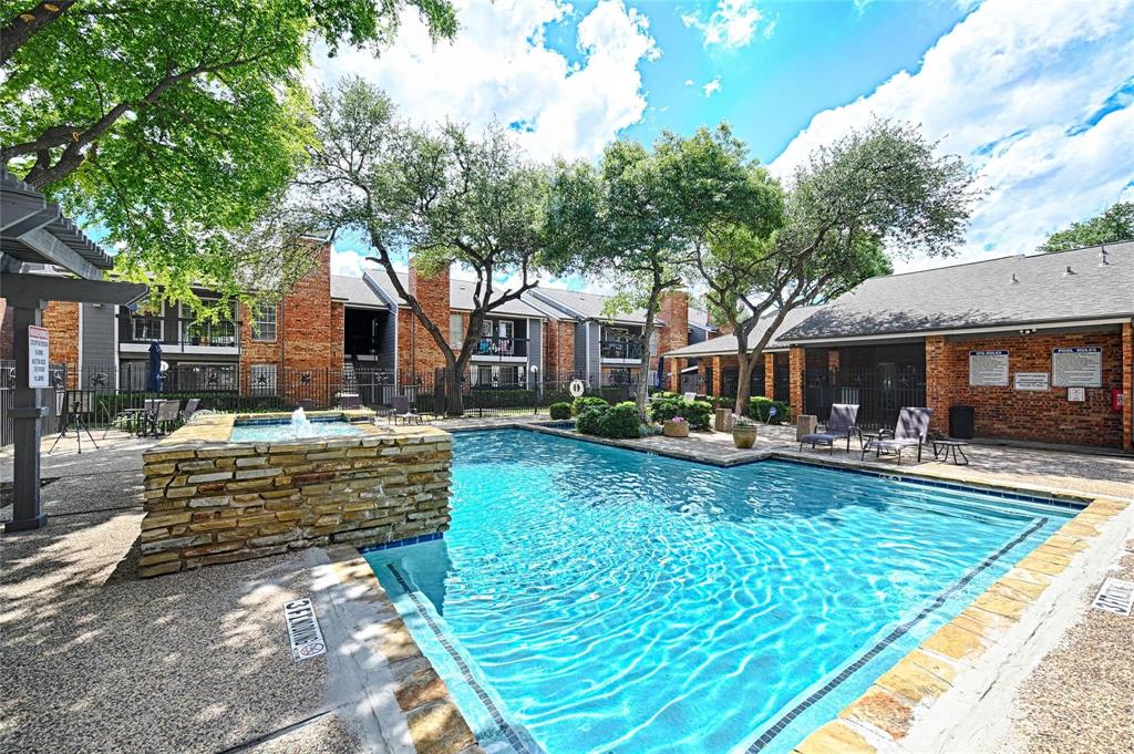 18333 Roehampton Drive, Unit 128 Dallas, TX 75252 - Photo 34 of 40 a view of house with yard outdoor seating and swimming pool