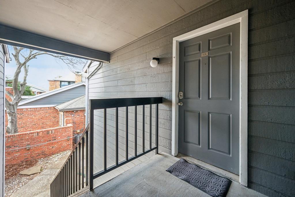 18333 Roehampton Drive, Unit 128 Dallas, TX 75252 - Photo 36 of 40 front view of a house with a glass door