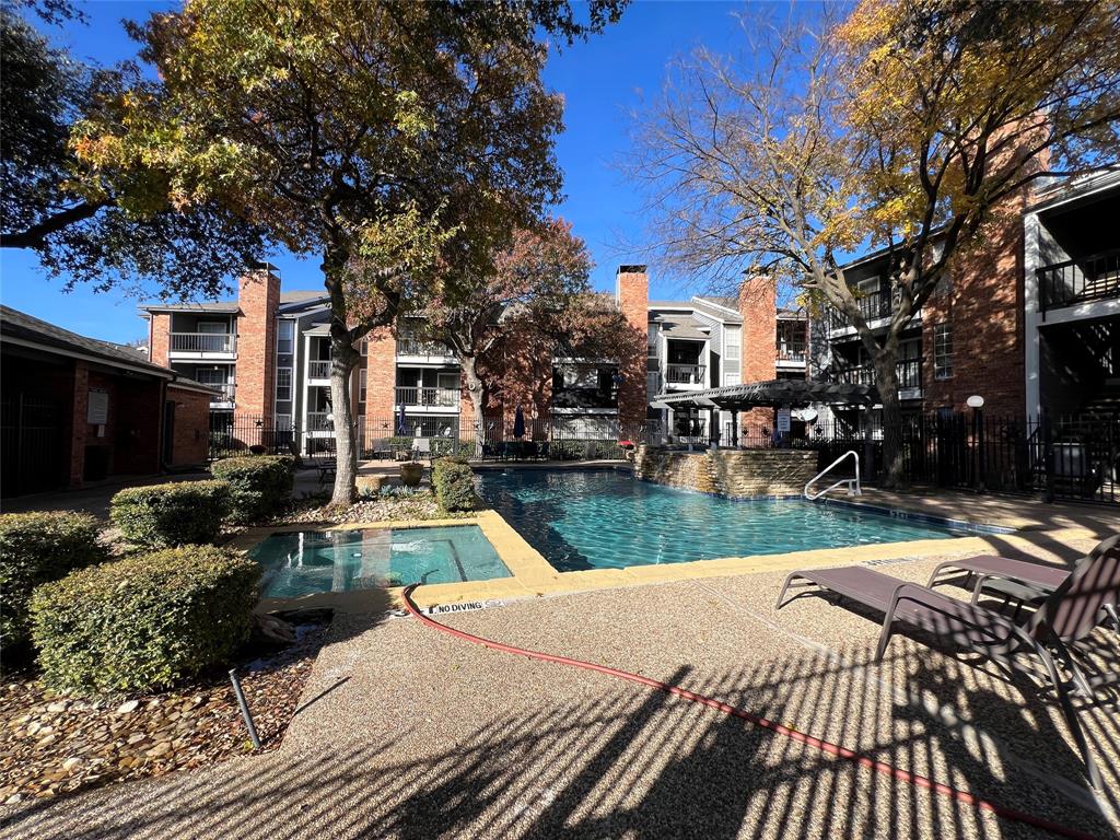 18333 Roehampton Drive, Unit 128 Dallas, TX 75252 - Photo 38 of 40 a view of a house with a yard