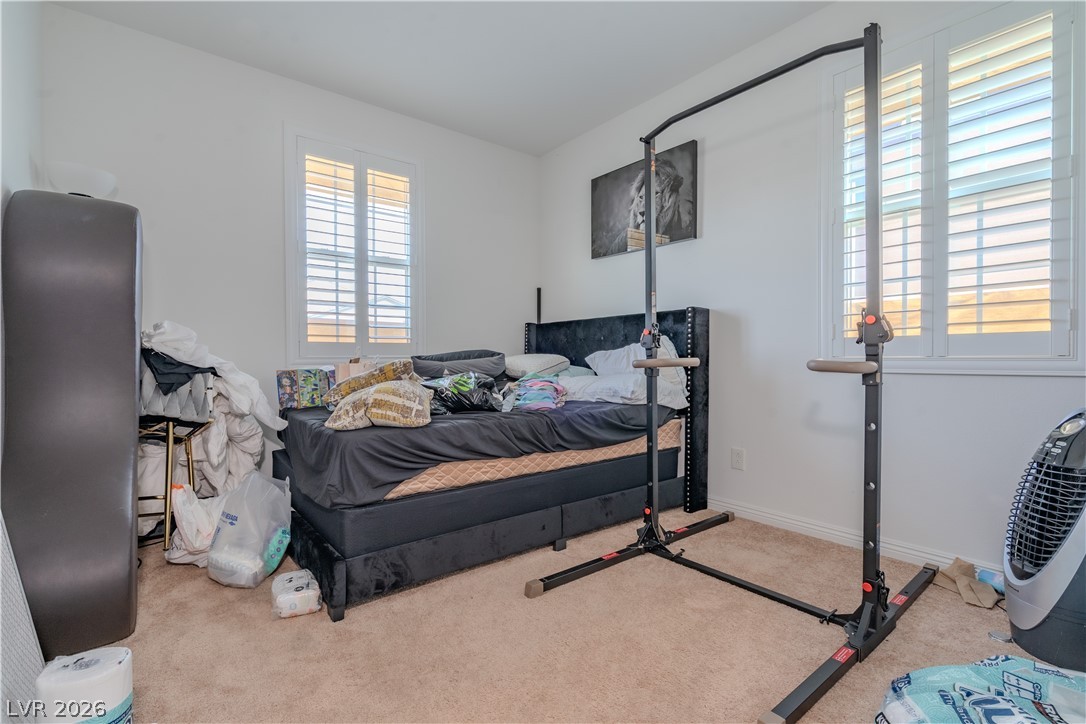 1239 Raritan Place Henderson, NV 89002 - Photo 17 of 26 Bedroom with light carpet and baseboards