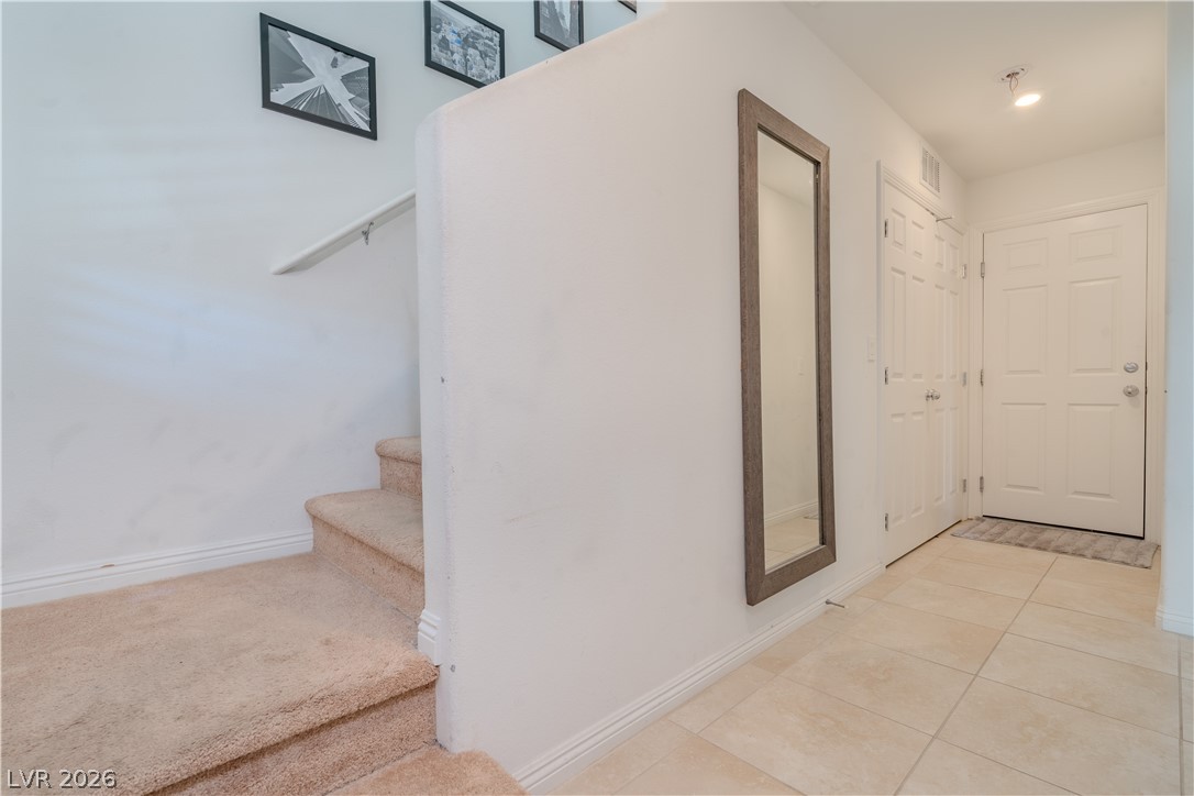 1239 Raritan Place Henderson, NV 89002 - Photo 8 of 26 Staircase featuring tile patterned floors and baseboards