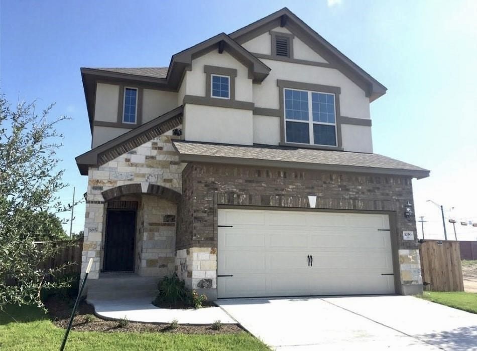 1036 Chad Loop Round Rock, TX 78665 - Photo 1 of 22 a front view of a house with garage