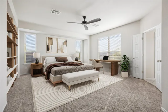 a bedroom with furniture and a window