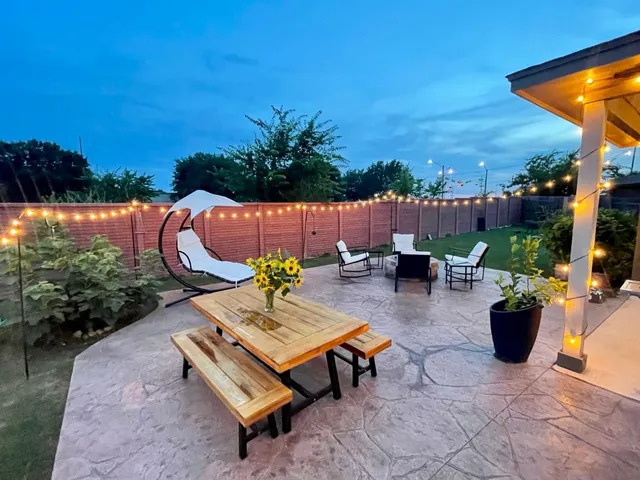 a view of a backyard with sitting area