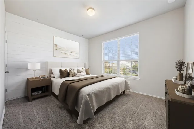 a bed room with bed and a window