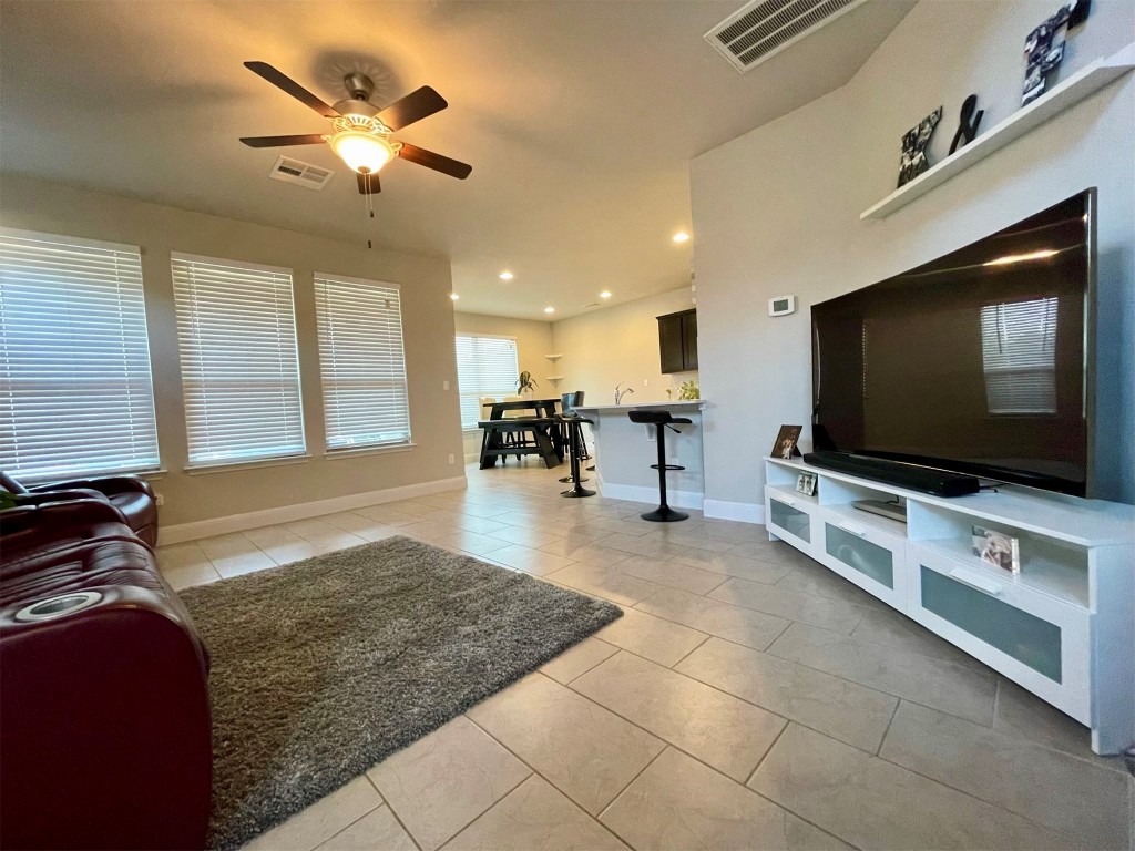 1036 Chad Loop Round Rock, TX 78665 - Photo 2 of 22 a living room with furniture and a flat screen tv