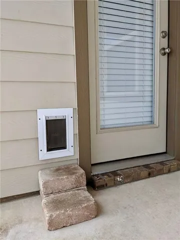 a view of a swimming pool with a table and a chairs