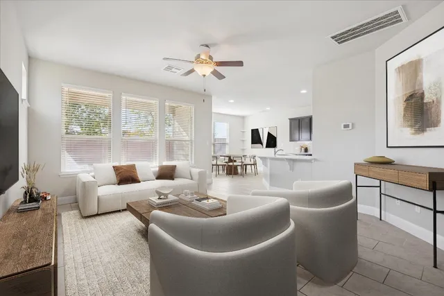 a living room with furniture and a large window