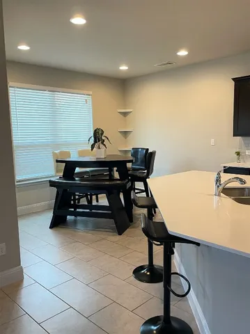 a view of a workspace with furniture