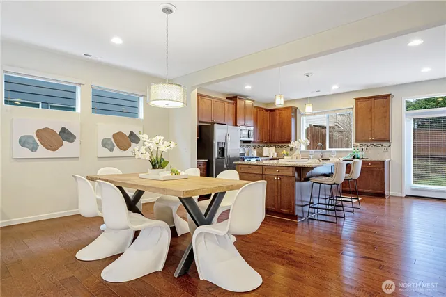 a view of a dining room with furniture window and wooden floor