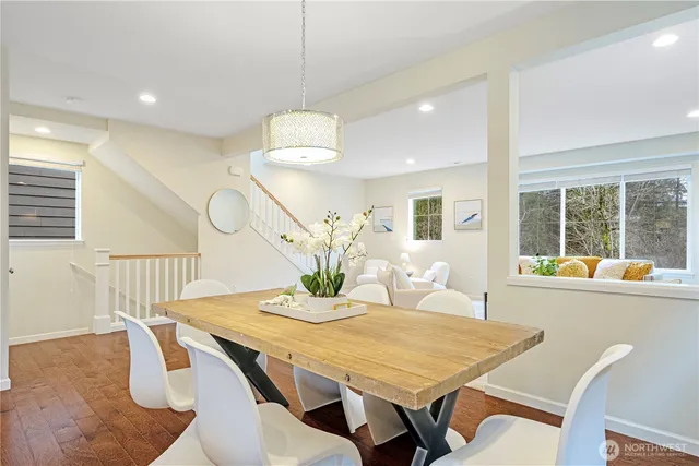 a view of a dining room with furniture window and wooden floor
