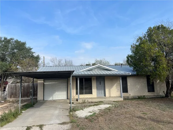 a front view of a house with a garage