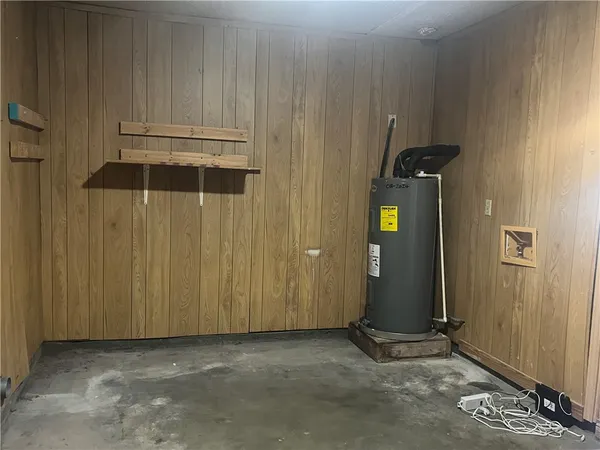 an empty room with wooden floor and closet