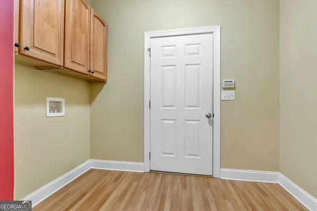 a view of room with window and hardwood