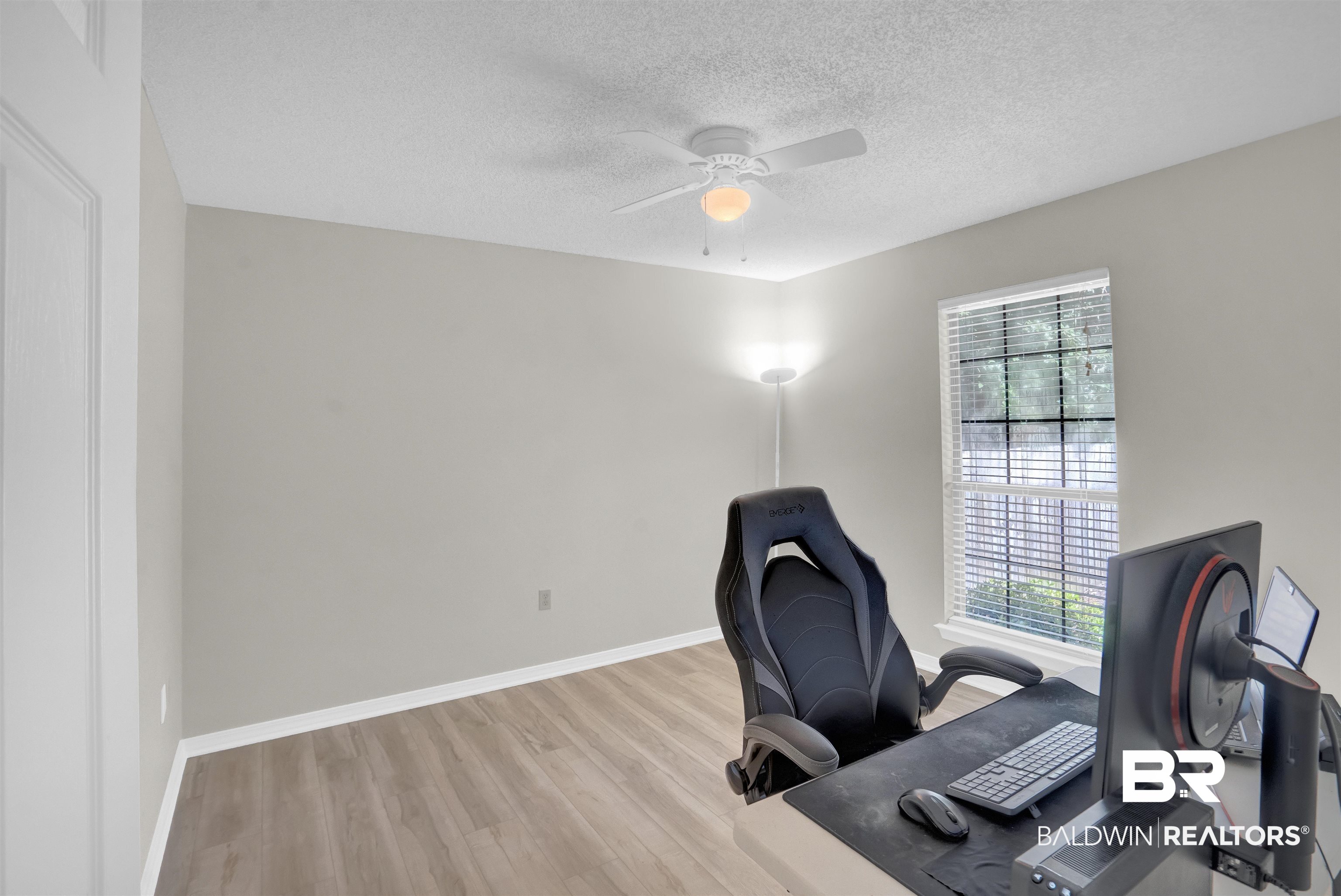 30871 Stanton Road Spanish Fort, AL 36527 - Photo 15 of 35 Home office featuring ceiling fan, a textured ceiling, and light hardwood / wood-style flooring